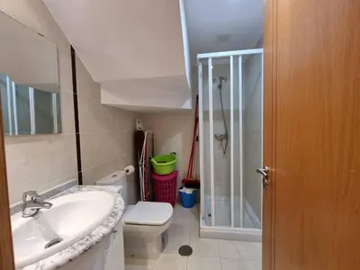 a bathroom with a toilet and a sink and a shower at Mirador al Cantabrico in Foz