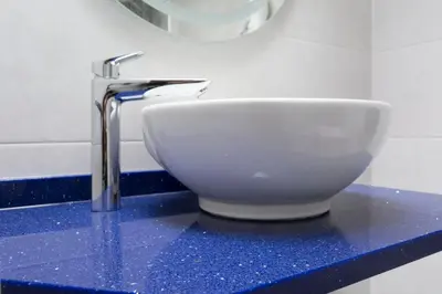 a bathroom sink with a faucet on a counter at Hotel Mica in Palas de Rei