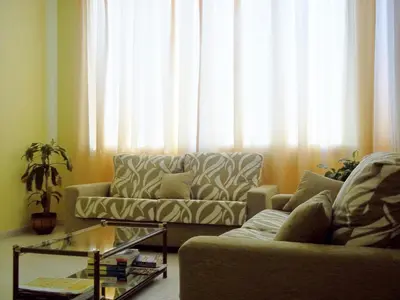 a living room with a couch and a coffee table at Hotel Suiza in Arzúa