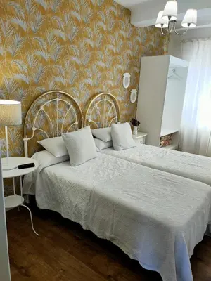 a bedroom with a large bed and a wall at Casa castro in Cruces