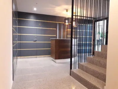 a hallway with a staircase and a glass door at Casona da Ponte in Portomarin