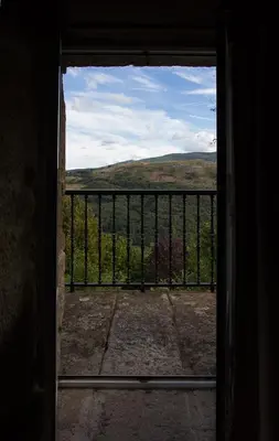 an open door to a balcony with a view at Casa do Comediante in Cerdeira