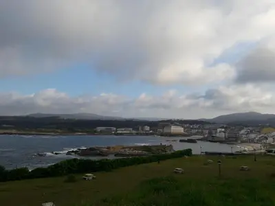 a view of a body of water with a city at Playa Caosa in San Ciprián