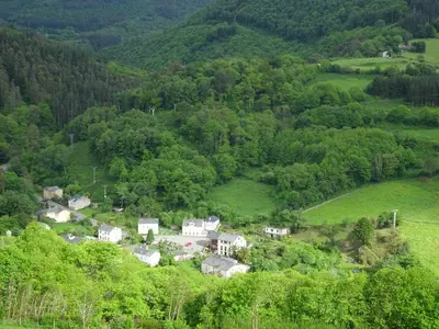 an aerial view of a house in the hills at Apartamentos El Llago in Boal