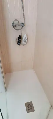 a small shower with a toilet in a bathroom at XOXO - Encina in Ponferrada
