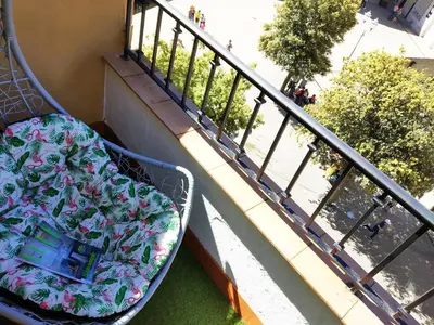 a bed sitting on a balcony next to a railing at XOXO - Encina in Ponferrada