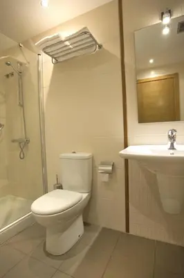 a bathroom with a toilet and a sink at Hotel Mar de Plata in Sarria
