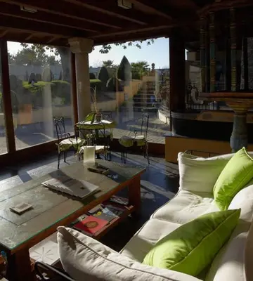 a living room with a couch and a table at Hotel Rural Casa Xusto in La Caridad