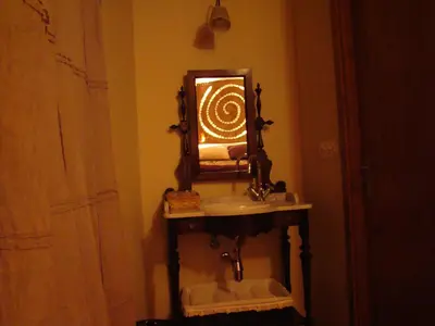 a bathroom with a sink and a mirror at A Casa de Mañas in Mondoñedo