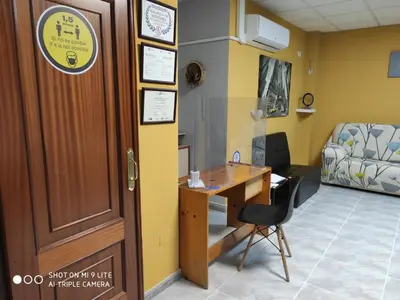 a doctors office with a desk and a bed at Arraigos in Melide