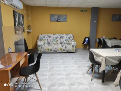 a living room with a couch and a table at Arraigos in Melide