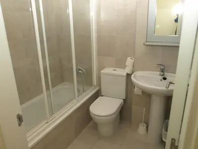 a bathroom with a toilet and a shower and a sink at PR Blanco in Santiago de Compostela