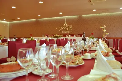 a table with wine glasses and food on it at Hostal-Restaurante Paris in Forcarei