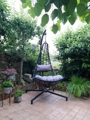 a bench sitting in the middle of a garden at casa cristimil -san amaro in Salamonde