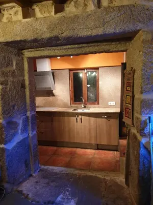 a kitchen with a sink and a window in a building at casa cristimil -san amaro in Salamonde