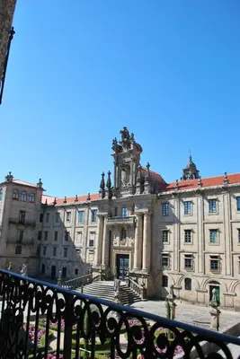 a large building with a clock tower on top of it at Pensión Acibeche in Santiago de Compostela