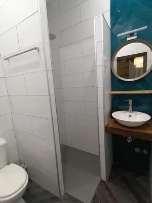 a bathroom with a toilet and a sink at El Puente Peregrino in Trabadelo