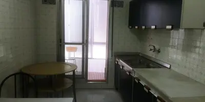 a kitchen with a sink and a table in it at Lar Cuche in Ourense