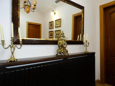 a mirror and candles on a dresser in a room at LAST 12K in Santiago de Compostela