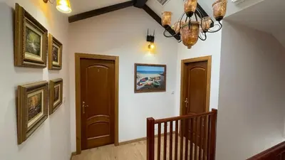 a hallway with two doors and a chandelier at LAST 12K in Santiago de Compostela