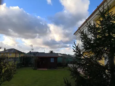 a view of a yard with a house at Apartamento Apega in Ribadeo