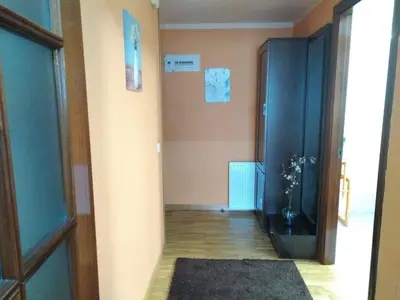 a room with a hallway with a door and a rug at El piso de Carlos in Ribadeo