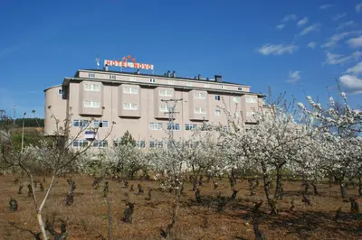 a building with a sign on the top of it at Hotel Novo in Ponferrada