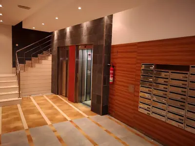 a walk in closet with wooden walls and a staircase at Duplex Tres Dormitorios Playa A Rapadoira in Foz