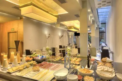 a buffet line with different types of food at NH Ourense in Ourense