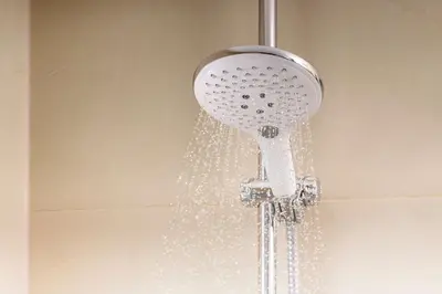 a shower head with water coming out of it at NH Ourense in Ourense