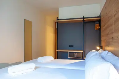 a bedroom with a bed with two white pillows at Plaza Obradoiro Express by Bossh! Hotels in Santiago de Compostela