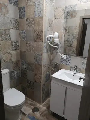 a bathroom with a toilet and a sink at Monqar Playa Foz in Foz