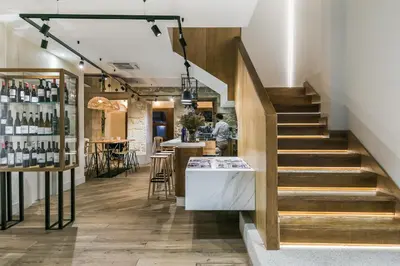 a staircase leading to a wine tasting room with a bar at Hotel Pousada Real in Caldas de Reis