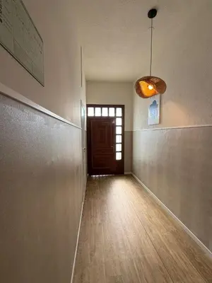an empty hallway with a door and a pendant light at Casa Grande do Costureiro-Para Grupos en Portomarín con Terraza y Vistas in Portomarin