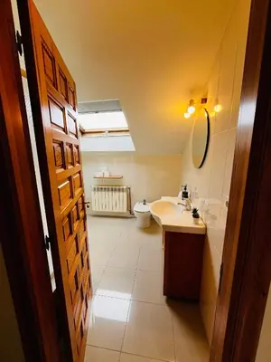 a bathroom with a sink and a toilet at Casa Grande do Costureiro-Para Grupos en Portomarín con Terraza y Vistas in Portomarin