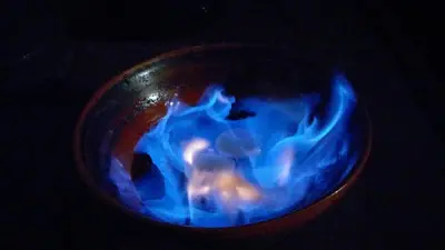 a bowl filled with blue and white smoke at Casa Turismo Rural O FILANDÓN in Suertes