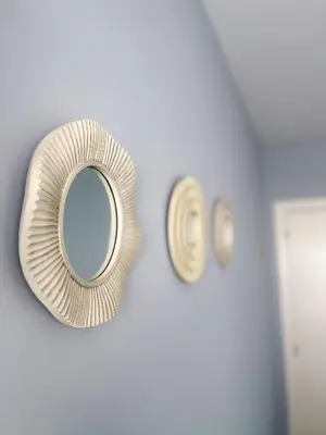 a mirror on a wall next to a door at Pension As Burgas Ii in Caldas de Reis