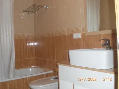 a bathroom with a sink and a toilet and a tub at La Mariña in Ribadeo