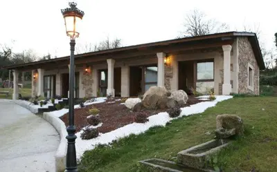 a house with a street light in front of it at Casa Barbadelo in Sarria