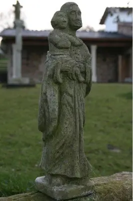 a statue of a woman holding a child at Casa Barbadelo in Sarria