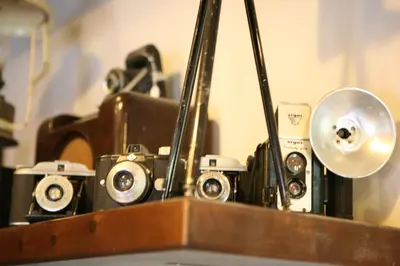 a bunch of cameras sitting on top of a table at Casa Barbadelo in Sarria