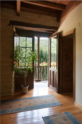 an open door to a room with a potted plant at Paraiso del Bierzo in Las Herrerías