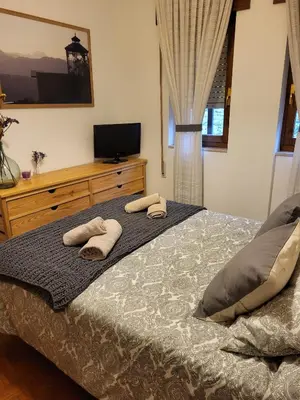 a bedroom with a bed with two towels on it at Villa Sabina 