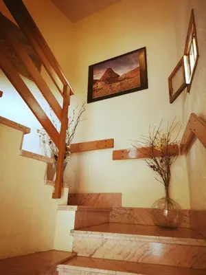 a room with stairs and a picture on the wall at Villa Sabina 