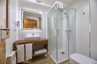 a bathroom with a sink and a shower at Casa Teodora by Adeloló in Arzúa