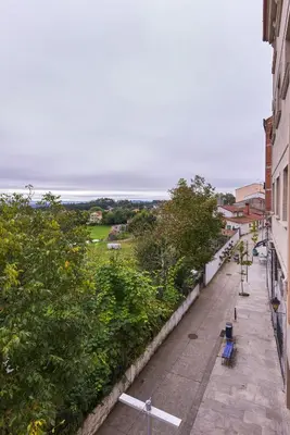 an empty street with a view of the ocean at Casa Teodora by Adeloló in Arzúa
