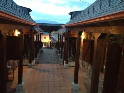 an alley in an old building with a street at Alojamientos Rurales El Fontano in Galende
