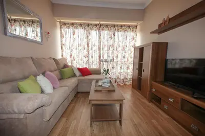 a living room with a couch and a table at Casa Rubieira in Sequeiro
