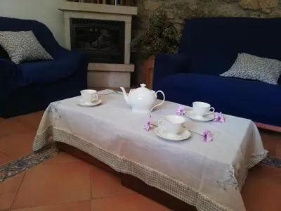 a table with two cups and saucers on it at Casa Da Pallota in Moraña