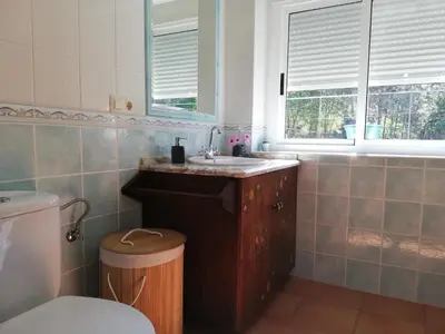 a bathroom with a sink and a toilet at Casa Da Pallota in Moraña